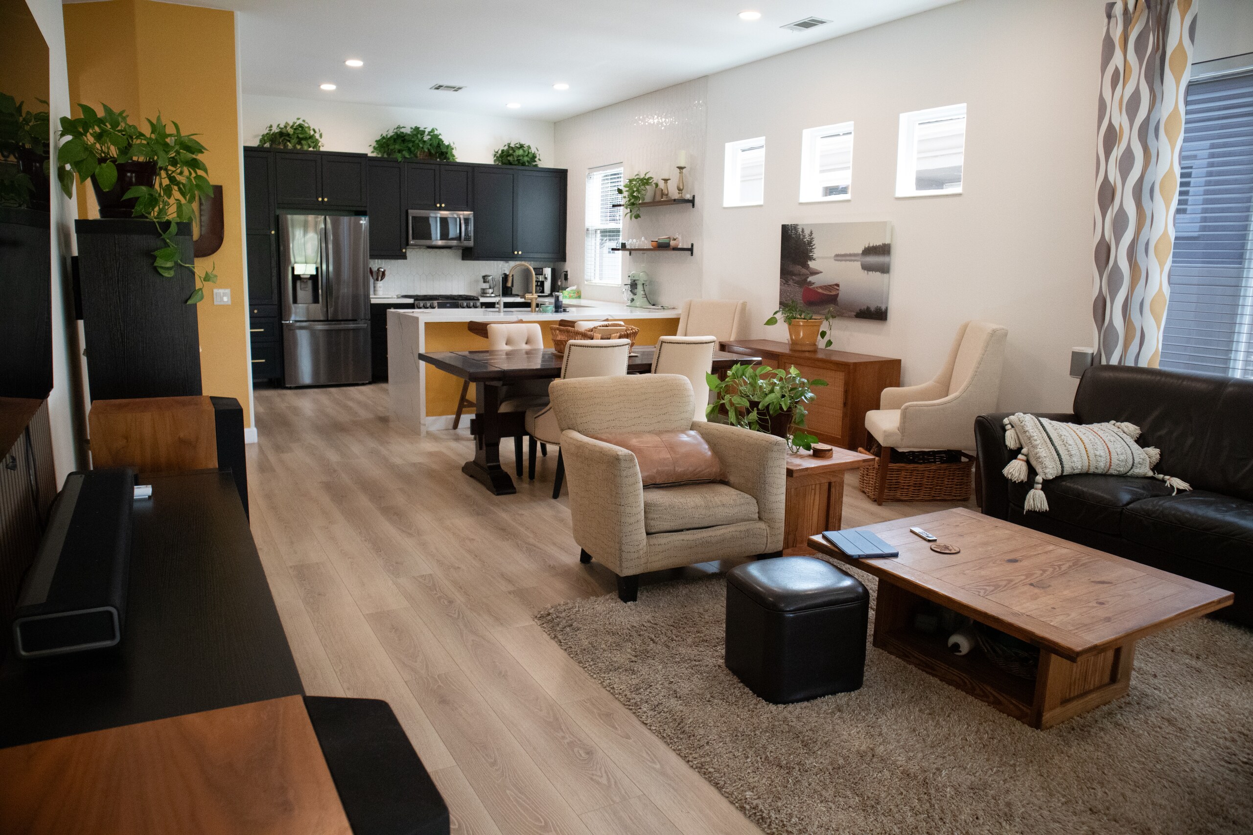 Open great room with the kitchen, dining area and living room connected