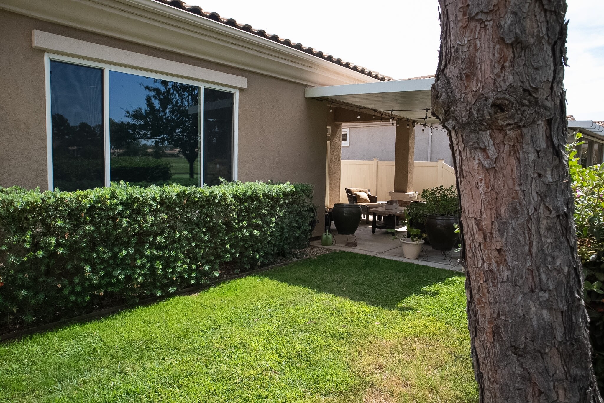Landscaped backyard with golf-course and mountain views